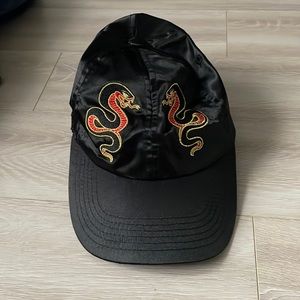 Black satin hat with gold snake embroidery